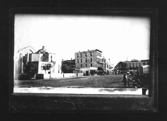 A black and white photo of a city
Description automatically generated